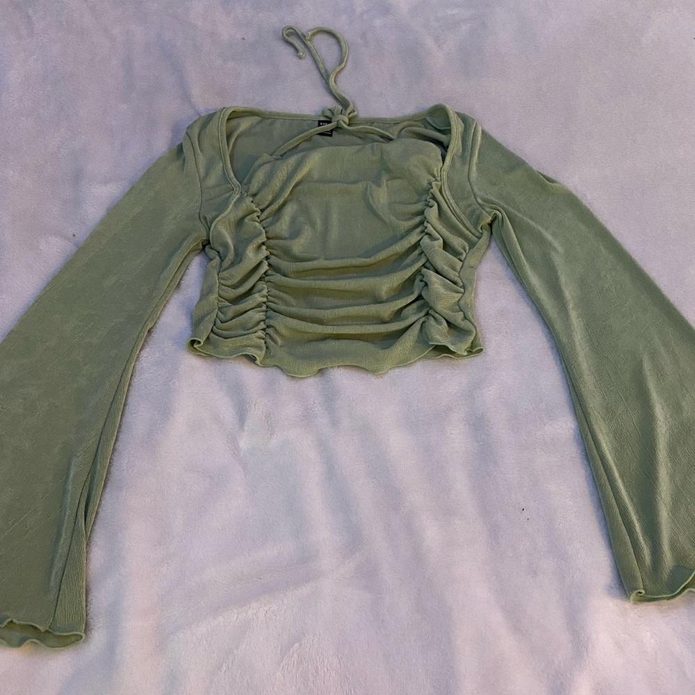 light weight and looks super cute. From shein and is size L. It’s a light green.